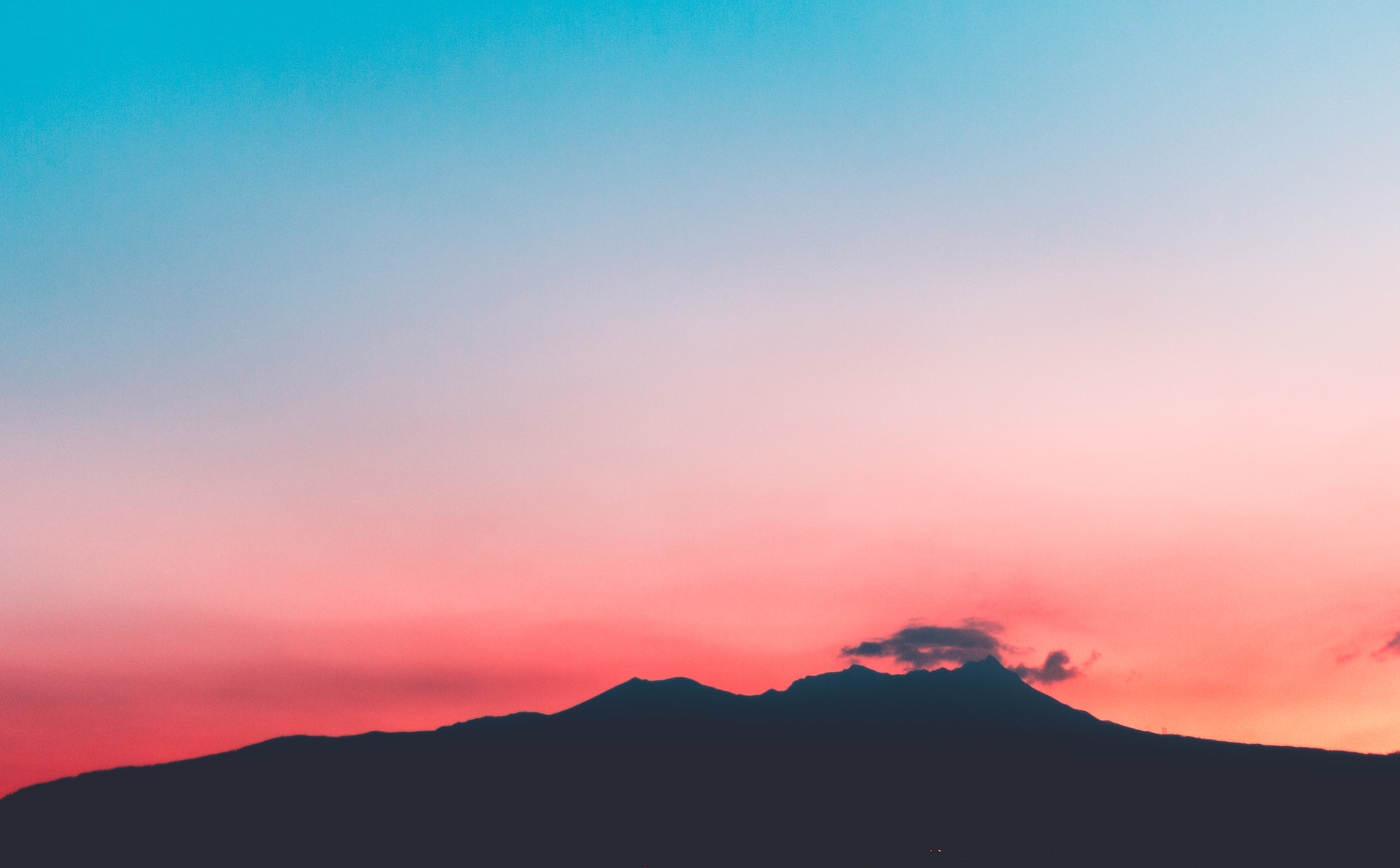 mountains under pink and blue skies