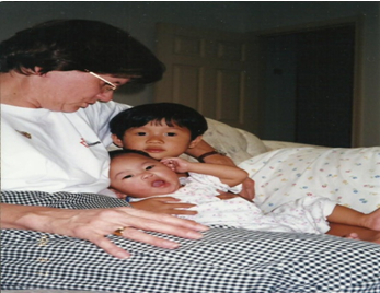 woman sitting with her children